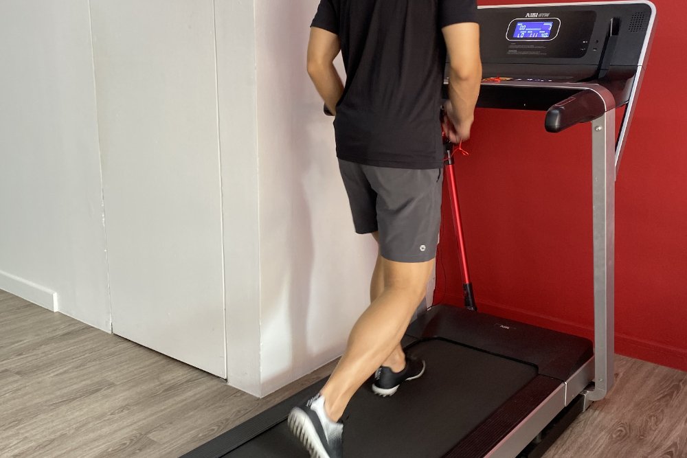 Patient running on a treadmill in a rehabilitation setting
