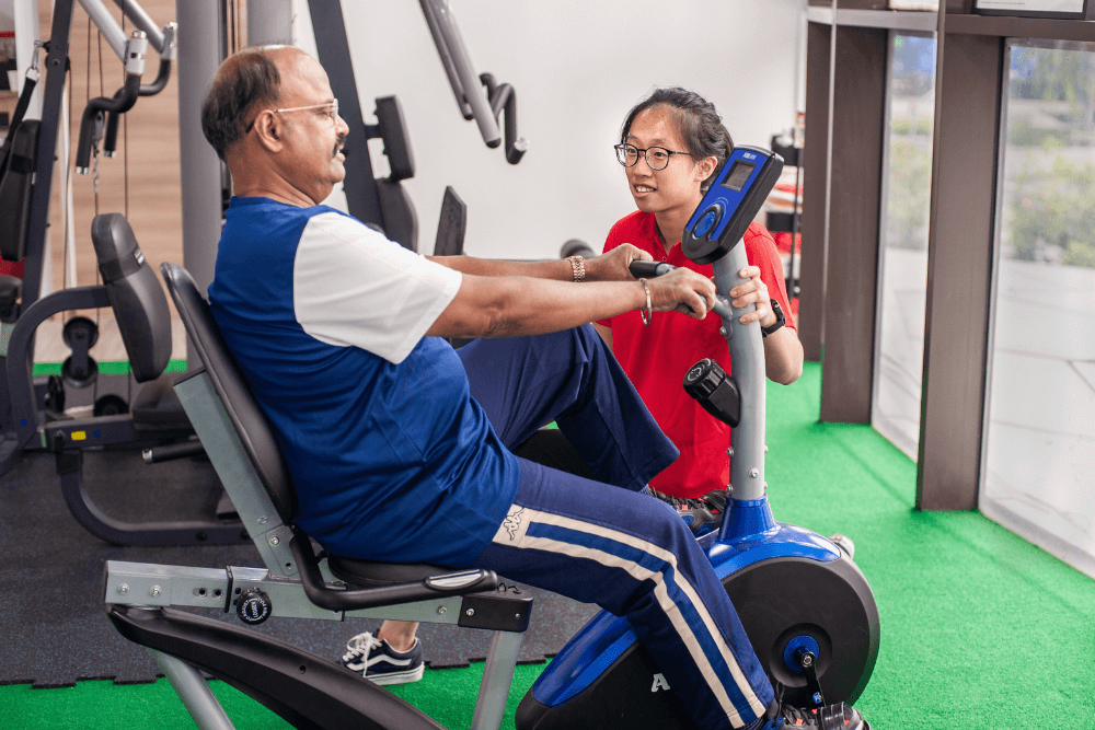 Physiotherapist assisting patient with an exercise technique